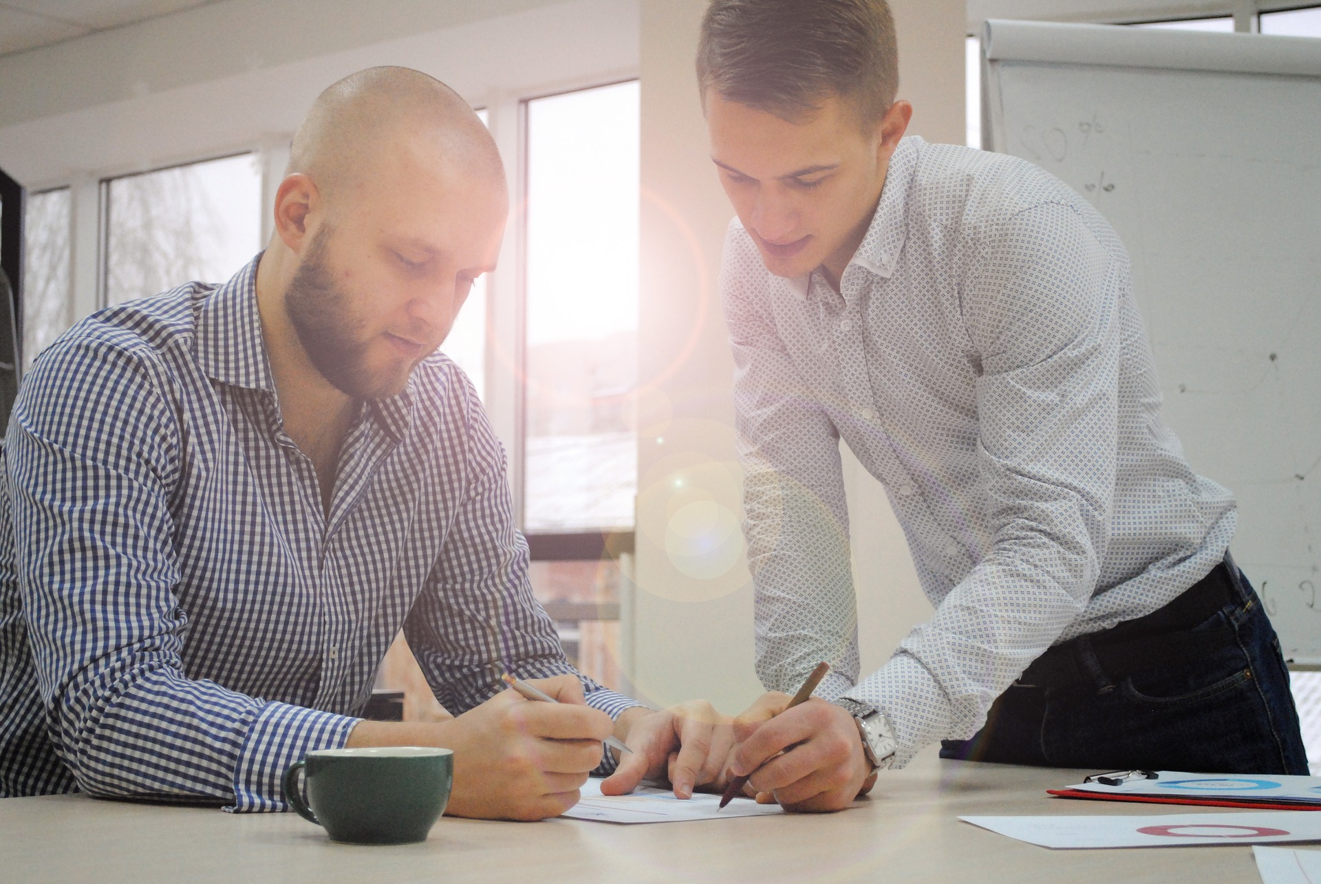 Two men discuss training 