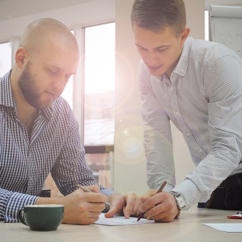 Two men discuss training 